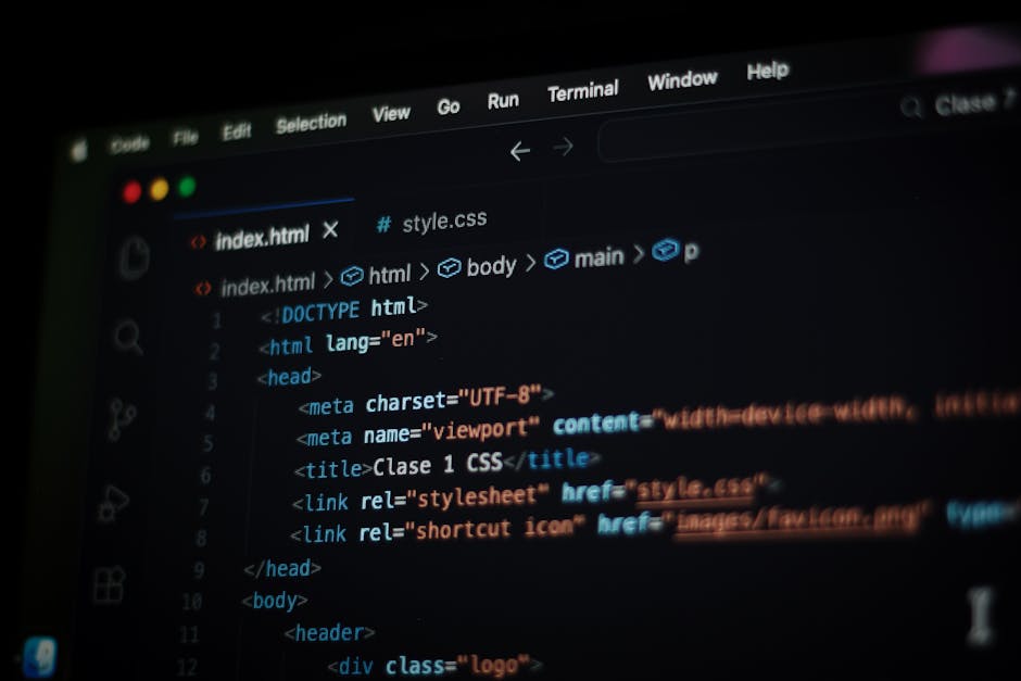 A close-up view of a laptop screen displaying lines of code in a text editor, with a focus on the programming syntax highlighted in various colors such as green, yellow, and blue. To the right of the 